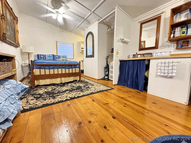 bedroom with ceiling fan and hardwood / wood-style floors