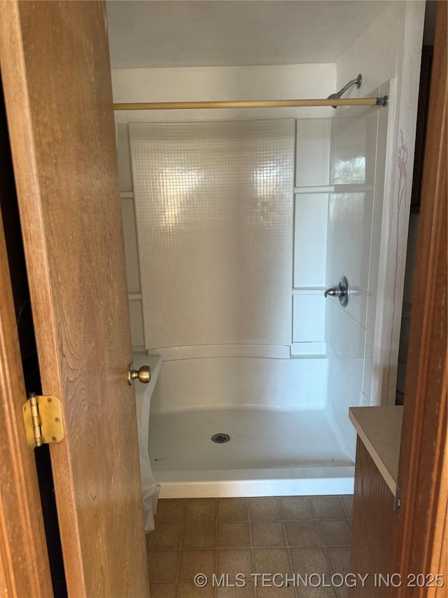 bathroom featuring tile patterned floors and walk in shower