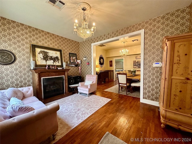 living room with a chandelier and hardwood / wood-style flooring