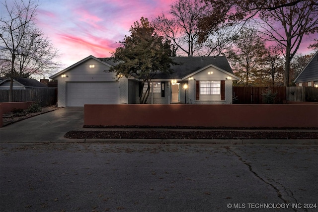 ranch-style house featuring a garage