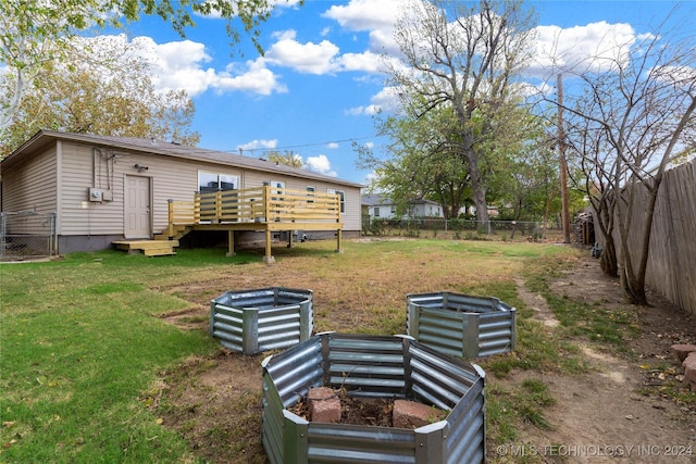 view of yard featuring a wooden deck