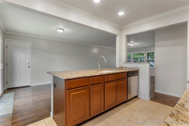 kitchen featuring dishwasher, light hardwood / wood-style flooring, ornamental molding, and sink