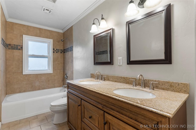 full bathroom with tile patterned flooring, crown molding, toilet, vanity, and tiled shower / bath