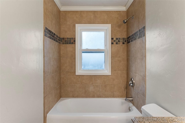 bathroom with tiled shower / bath combo, toilet, and crown molding