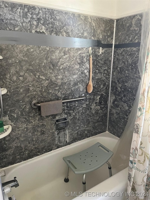 bathroom with a shower with curtain