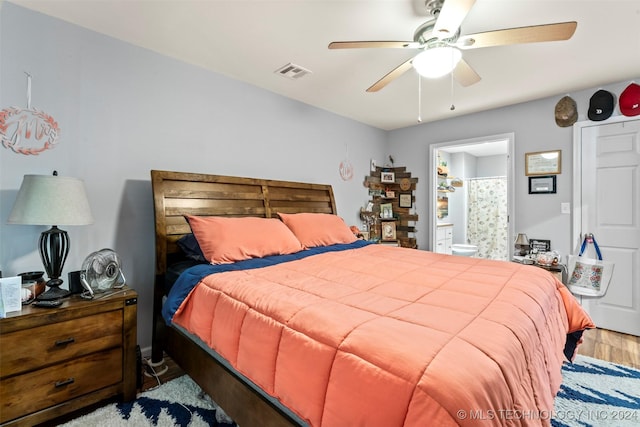 bedroom featuring ceiling fan, wood-type flooring, and connected bathroom