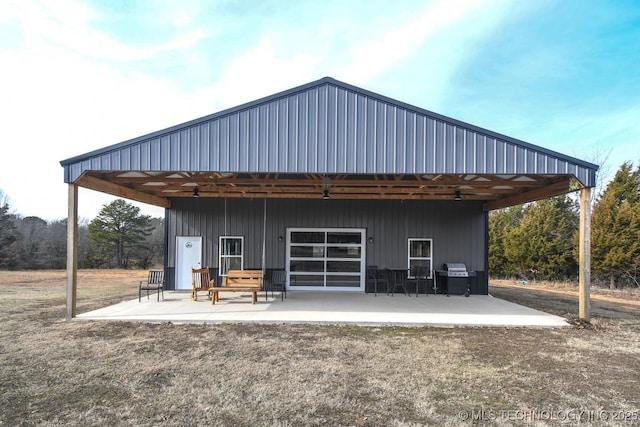 back of house with a patio