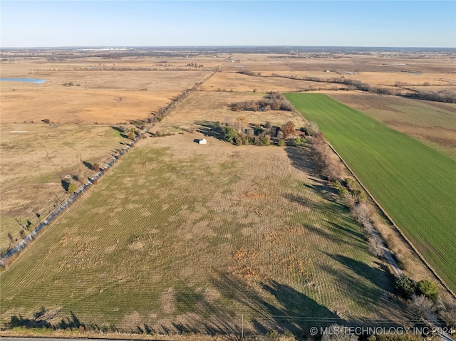 birds eye view of property with a rural view