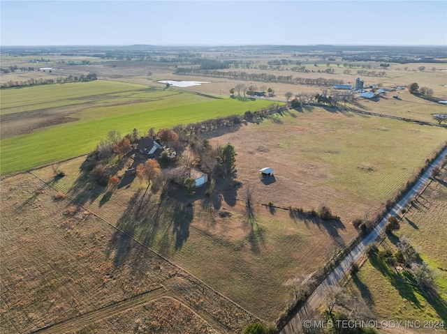 birds eye view of property with a rural view