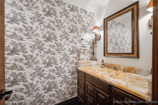 7133 S 425th Rd, Inola, OK 74036 - bathroom featuring crown molding, vanity, and wallpapered walls
