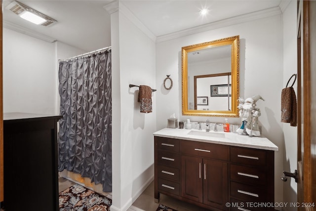 bathroom featuring vanity, curtained shower, and crown molding