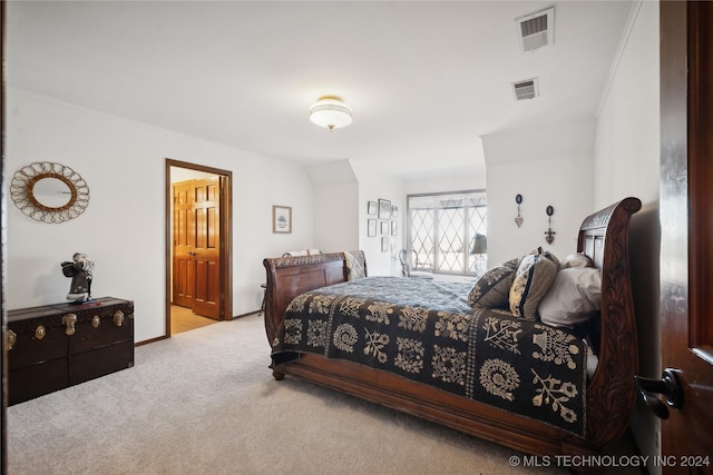 bedroom with light colored carpet and ornamental molding