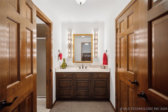 bathroom featuring tile patterned floors and vanity