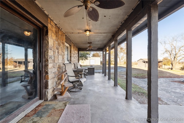 view of patio featuring ceiling fan