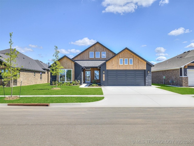 view of front facade with a garage and a front yard