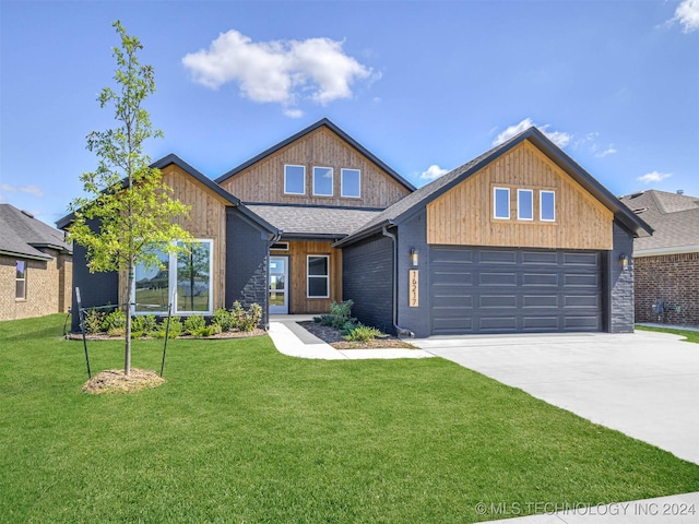 craftsman-style home with a garage and a front lawn