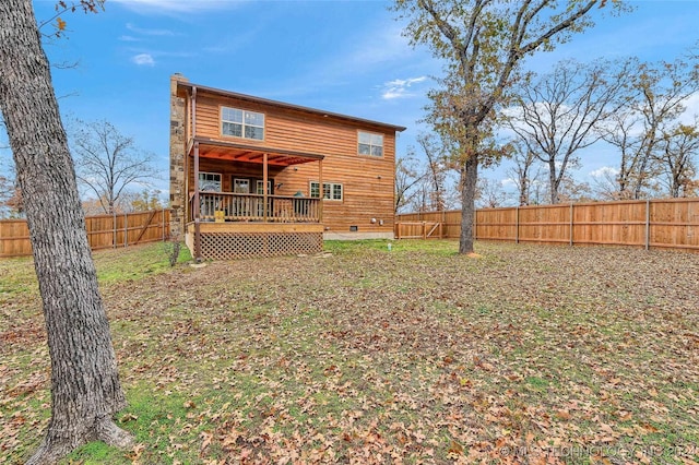 rear view of property featuring a deck