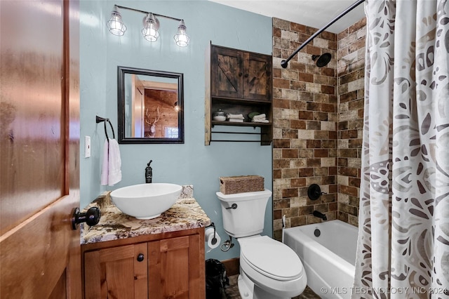 full bathroom with vanity, shower / tub combo, and toilet