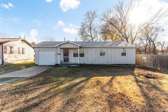 view of front facade with a garage and a front yard