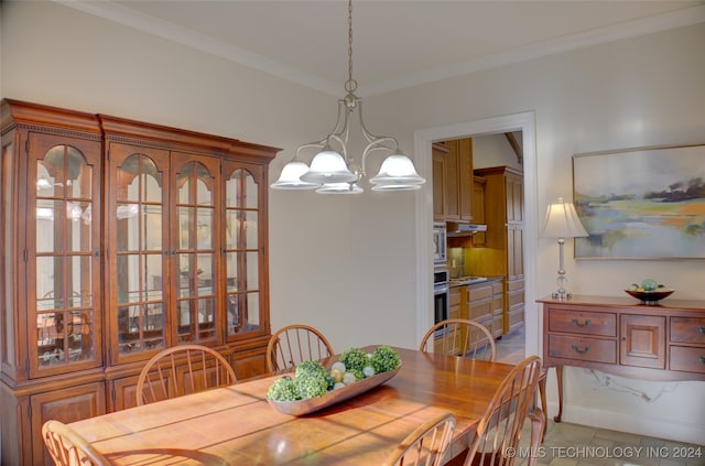 tiled dining space featuring crown molding and a notable chandelier