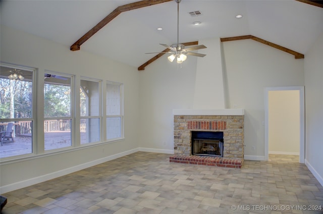 unfurnished living room featuring beam ceiling, ceiling fan, high vaulted ceiling, and a brick fireplace