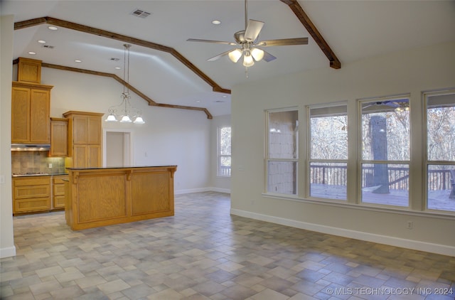 kitchen featuring hanging light fixtures, gas cooktop, backsplash, vaulted ceiling, and ceiling fan with notable chandelier