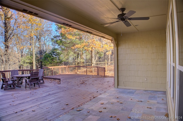 wooden terrace featuring ceiling fan