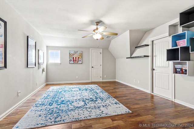 additional living space featuring ceiling fan, dark hardwood / wood-style flooring, and vaulted ceiling