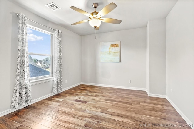 unfurnished room with ceiling fan and light hardwood / wood-style flooring