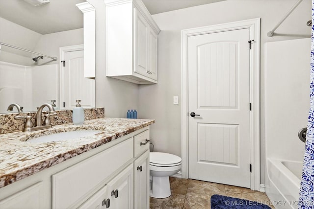 full bathroom featuring vanity, shower / bathtub combination with curtain, and toilet