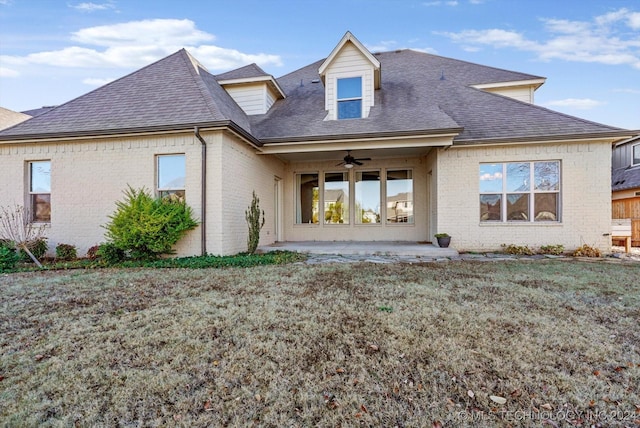 back of property featuring ceiling fan, a patio area, and a yard