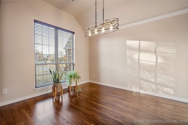 spare room with lofted ceiling, crown molding, a healthy amount of sunlight, and dark hardwood / wood-style floors