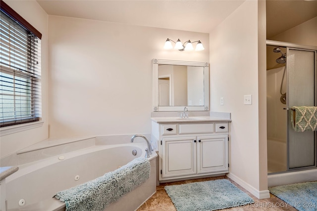 bathroom featuring tile patterned floors, vanity, and plus walk in shower