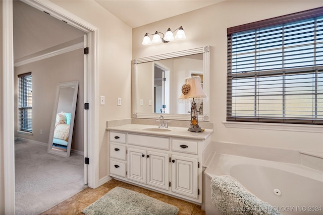 bathroom featuring vanity, tile patterned floors, and a tub