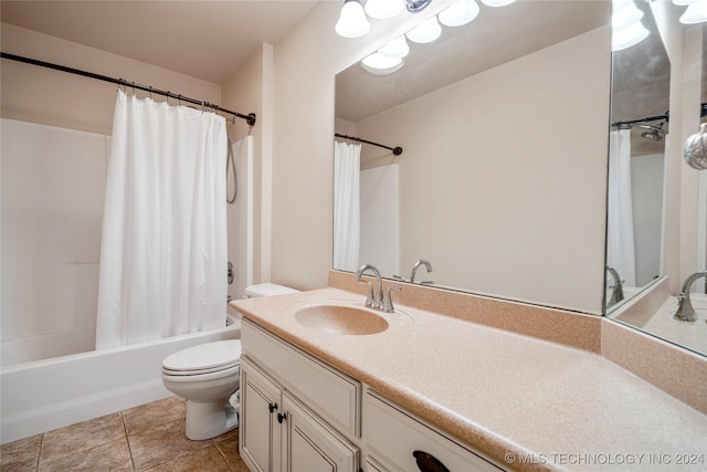 full bathroom featuring tile patterned flooring, shower / bath combo, vanity, and toilet