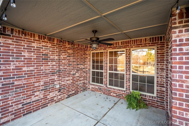 view of patio featuring ceiling fan