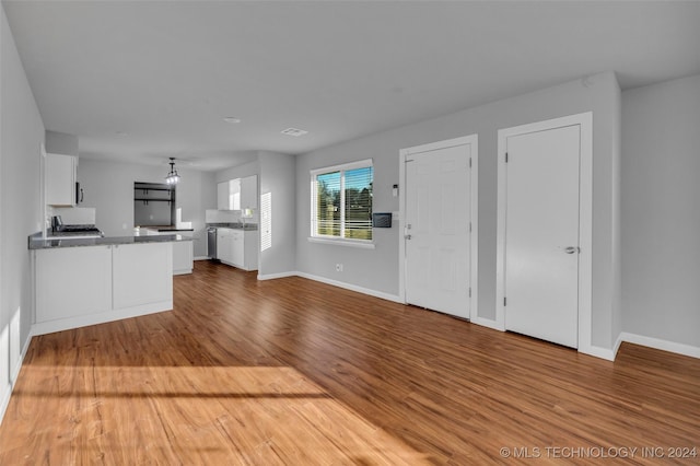 unfurnished living room featuring wood-type flooring