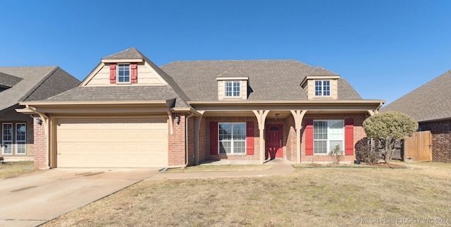 view of front facade with a garage and a front yard