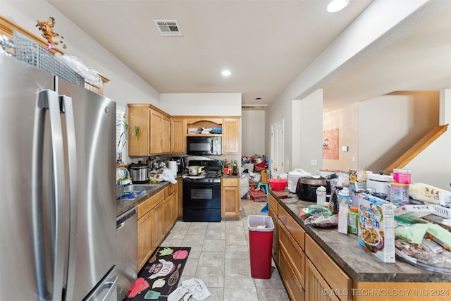 kitchen with black appliances and sink