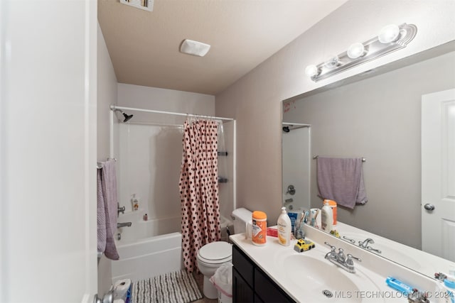 full bathroom with vanity, toilet, and shower / bath combo with shower curtain