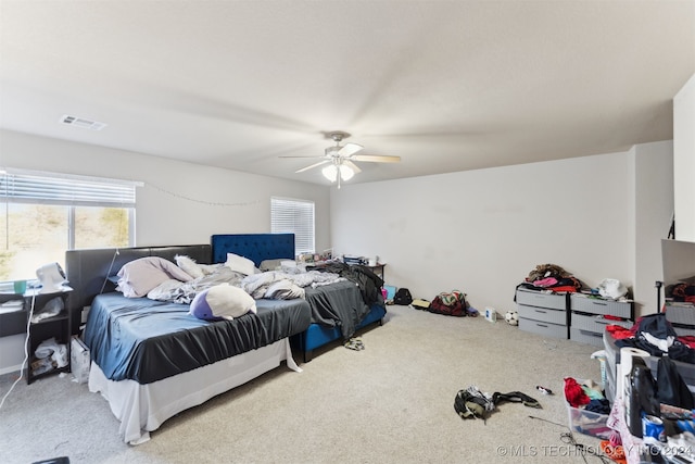 carpeted bedroom with ceiling fan