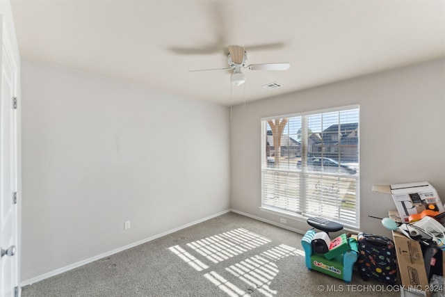 game room with light colored carpet, a wealth of natural light, and ceiling fan