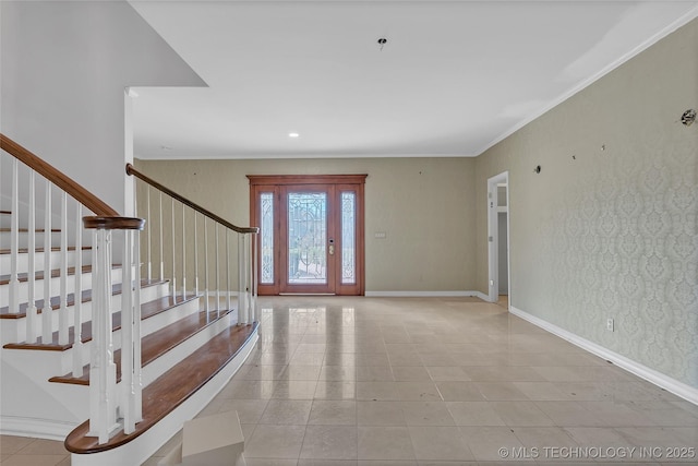 entryway featuring crown molding