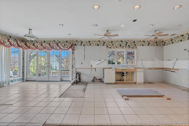 interior space featuring sink, ceiling fan, and light tile patterned floors