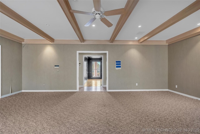 carpeted spare room featuring ceiling fan and beam ceiling