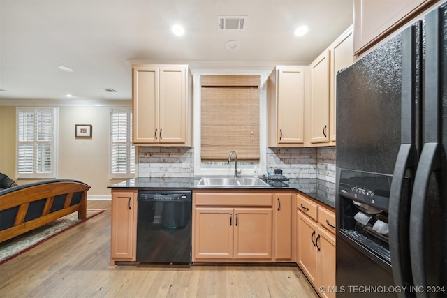 kitchen with backsplash, black appliances, sink, light wood-type flooring, and ornamental molding