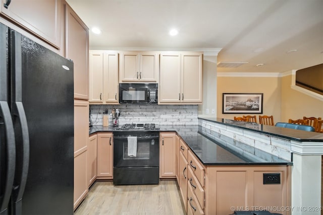 kitchen with kitchen peninsula, crown molding, light hardwood / wood-style flooring, and black appliances