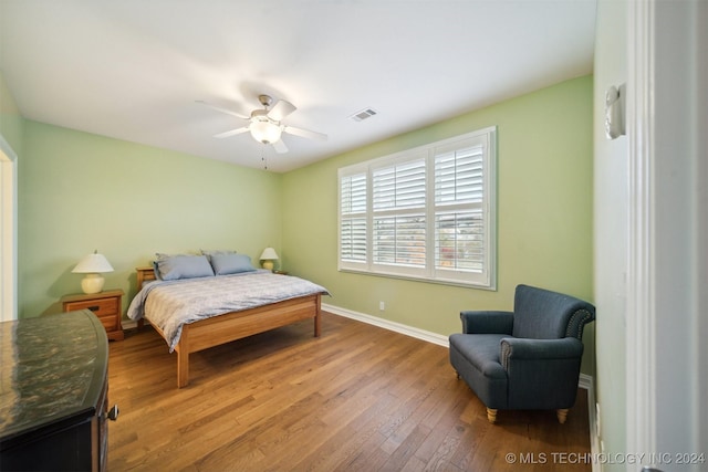 bedroom featuring ceiling fan and hardwood / wood-style flooring