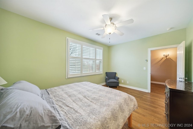 bedroom featuring hardwood / wood-style floors and ceiling fan