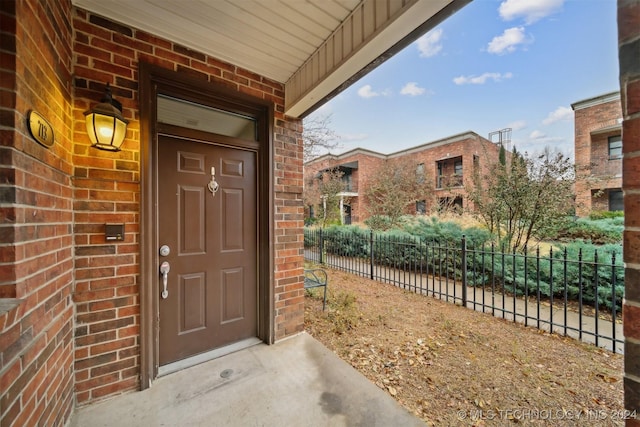 view of exterior entry featuring a porch